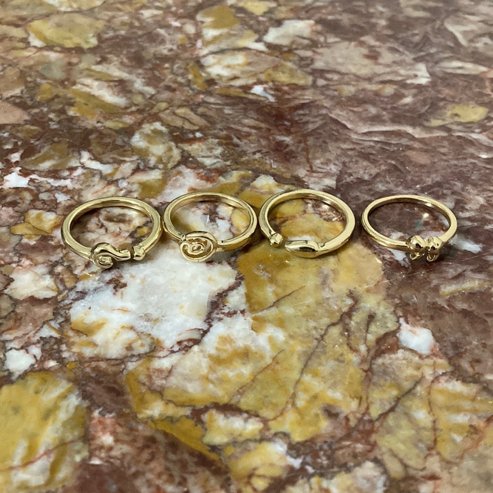 Set of 4 Gold-Colored Metal Rings with Punctuation Marks